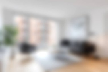 Modern mobilyaların, büyük pencerelerin ve rahat bir atmosferin bulunduğu, şık bir mekanda rahatlamak ve keyif almak için mükemmel bir oturma odası..