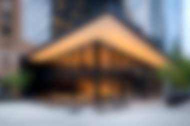 Modern mimarinin çarpıcı bir örneğini keşfedin geometrik tasarım ve canlı bir şehir ortamı. Görüntü, doğa ve yapının karışımını yakalıyor, davetkar atmosferi vurguluyor..