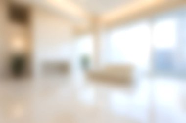 Bu resim, doğal ışıkla aydınlanan, yumuşak, bulanık, modern bir oturma odasını sergiliyor. Rahatlamak ve rahatlamak için mükemmel sıcak ve davetkar bir atmosfer yaratıyor..