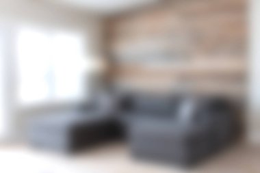 Bu resim, ahşap bir aksan duvarıyla eşleştirilmiş şık, gri bir kanepenin bulunduğu rahat bir oturma odasını tasvir ediyor. Doğal ışıkla dolu sıcak bir atmosfer yaratıyor. Rahatlama ve günlük toplantılar için mükemmel..