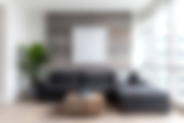 Bu resim, rahat mobilyaların, geniş pencerelerin ve şık bir rahatlama için mükemmel doğal ışık atmosferinin olduğu modern bir oturma odasını gösteriyor..