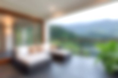 Huzurlu, modern bir salon düşünün rahat mobilyaları olan, büyüleyici dağ manzaraları ve yemyeşil manzaralar sunan manzaralı bir yer..