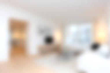 Modern mobilyaların ve yumuşak ışıkların bulunduğu sakin ve davetkar bir oturma odası. Rahatlamak için mükemmel. Minimalist tasarım, sakin atmosferi güçlendirir..