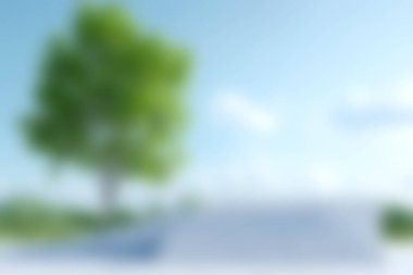 Güzel, yemyeşil bir ağaç açık mavi bir gökyüzüne karşı duruyor, yumuşak beyaz bulutlarla çevrili, huzurlu ve huzurlu bir doğa sahnesi yaratıyor dinlenmek için mükemmel..