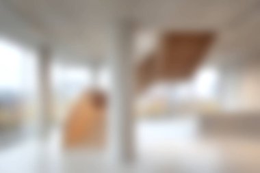 Ahşap aksanlı minimalist tasarım elementleri ve geniş doğal ışık içeren modern iç mekan. Huzurlu ortamda temiz çizgiler ve yenilikçi mimari sergileniyor.