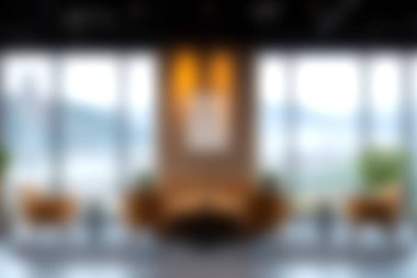 Doğal ışığı davet eden, rahatlama ve sosyal bağlantı için davet edici bir alan yaratan geniş pencereli modern bir salon alanı.