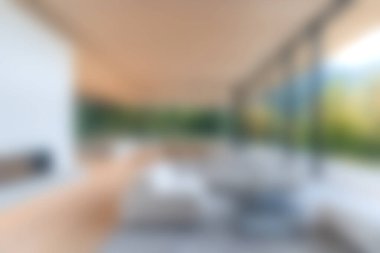 Bu resim, çarpıcı bir açık hava manzarası sunarken doğal ışığı davet eden geniş bir konsept yaşam alanına sahip modern bir minimalist iç tasarım sergiliyor..