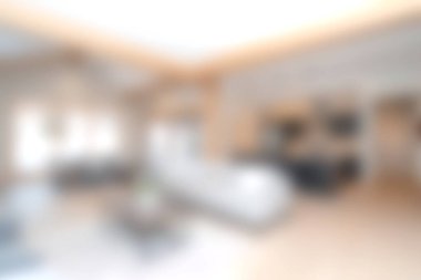 Bu resim zarif mobilyalar ve yumuşak ışıklandırmayla modern ve minimalist bir oturma odasını yakalar. Tarafsız renk düzeni sakin ve davetkar bir atmosfer yaratıyor..