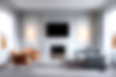 Rahat mobilyaların ve yumuşak nötr tonlarda zarif dekorun bulunduğu, şık rahatlama ve rahatlama için mükemmel bir modern oturma odası keşfedin..