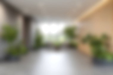 Parlak doğal ışık ve canlı bitkilerin yer aldığı, dinlenmek ve ilham vermek için ideal sakin bir atmosfer yaratan çağdaş bir kapalı alan..