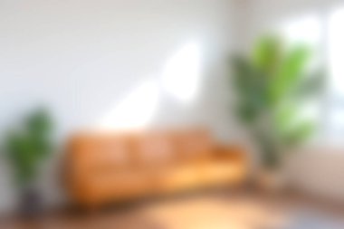 Parlak ve davetkar oturma odasında sıcak tonlarda, rahat bir kanepede ve canlı yeşil bir bitki sergilenir. Rahatlama ve tarz ilhamı için mükemmeldir..