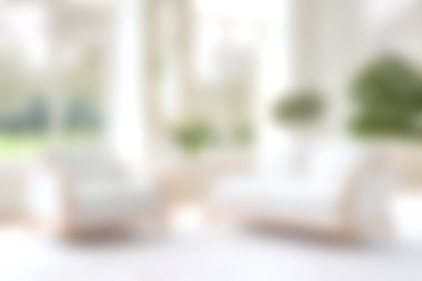 Bu görüntü, doğal ışıkla yıkanmış modern beyaz mobilyaların bulunduğu parlak ve havadar bir oturma odası yakalıyor. Rahat ve davetkar bir ortam yaratıyor..