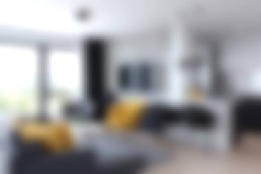 Bu rahat modern oturma odasında şık mobilyalar ve parlak aksanlar sergileniyor, doğal ışık ve sıcaklıkla dolu bir davet alanı yaratıyor..