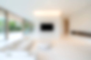 Bu modern oturma odası geniş pencereli, bol doğal ışık ve sakin bir atmosfer sağlayan minimalist bir tasarıma sahiptir. Rahatlama ve tarz için mükemmel..