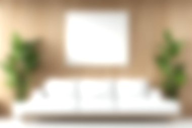 Beyaz bir kanepe ve bej bir duvarın karşısında yemyeşil bitkilerin olduğu güzel bir oturma odası. Modern tasarım ve konforu vurguluyor.