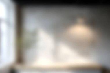 Modern bir iç mekan gösteren, doğal ışık ve minimalist dekor unsurlarını vurgulayan yumuşak odaklı bir görüntü. Tasarım bir huzur ve sükunet hissi uyandırıyor..