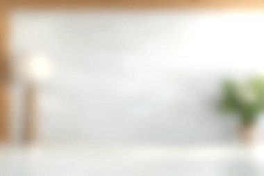 Bu resim, hafif ışıklandırma ve yeşil bir bitkiyle modern minimalist bir iç mekanın yumuşak ve bulanık bir görünümünü sergiliyor, rahatlatıcı ve şık bir atmosfer yaratıyor..