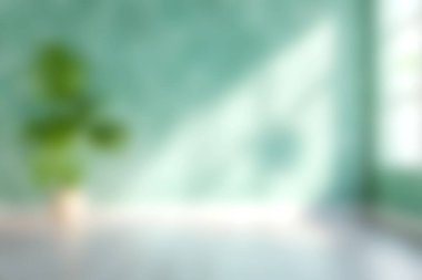 Yumuşak odaklı bir resim canlı yeşil bir duvarın yanında modern bir bitki yakalıyor, iç tasarım projeleri için mükemmel, sükunet ve stil sergiliyor..