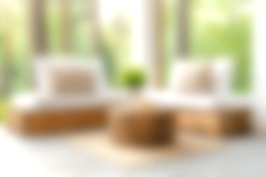 Bu resim, doğal ışıkla dolu modern ve rahat bir oturma odasını, minimalist mobilyaları ve rahatlamak için mükemmel bir atmosferi sergiliyor..