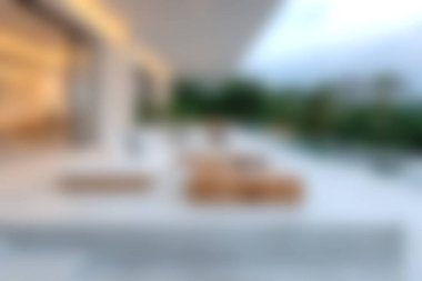 Bu resim modern mobilyaların ve yemyeşil bahçe manzarasının bulunduğu güzel bir açık hava salonu sergiliyor. Sofistike ama rahatlatıcı bir atmosfer yaratıyor..