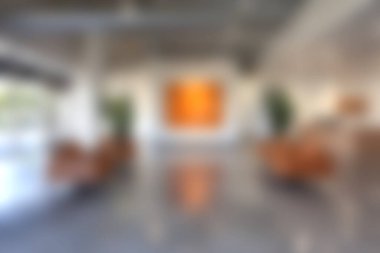 Geniş, minimalist, rahat koltuklar, sanatsal duvar görüntüsü ve canlı bir dekorasyonla donatılmış bir iç mekan. Çağdaş alanlar ve yaratıcı ortamlar için ideal.