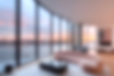 Bu çarpıcı modern oturma odası, nefes kesici günbatımı manzaraları sunan, dinlenmek ve rahatlamak için ideal sakin ve davetkar bir atmosfer yaratan tavandan tavana pencerelere sahiptir..