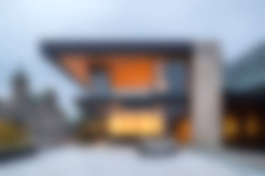 Bu resim çağdaş yerleşim ortamında çarpıcı modern mimari tasarım, parlak çizgiler ve sıcak ışıklandırma sergiliyor, tasarım için ideal..