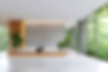 Güzel tasarlanmış, yemyeşil bir bahçe manzarası sunan geniş pencereli, modern bir yaşam alanı. Minimalist dekor sükuneti teşvik ediyor.