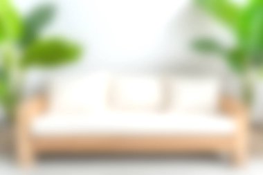 Parlak ve havadar bir oturma odası sahnesi rahat ve rahatlamak ve rahatlamak için mükemmel yeşil bitkiler çerçeveli yumuşak yastıklı rahat bir kanepe..