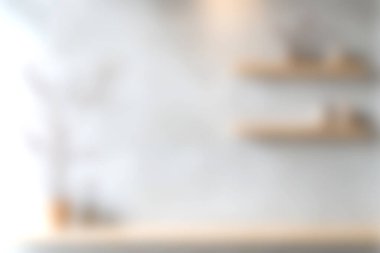 Bu yumuşak odak arkaplanı bir ışık duvarına karşı dekoratif öğelerle basit raflar içerir. Minimalist iç tasarım kavramları ya da yaşam tarzı tasvirleri için mükemmel..