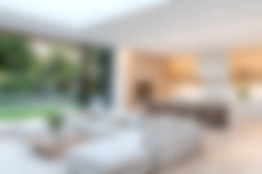 Modern estetiğe sahip güzel tasarlanmış bir oturma odası, bol doğal ışık ve açık bir düzen içeriyor. Dekor konforu ve sıcaklığı davet eder..