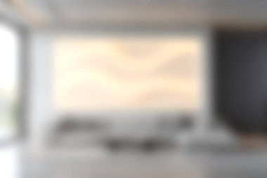 Güzel tasarlanmış modern bir oturma odası şık bir kanepe, soyut bir duvar sanatı, ve sakin bir atmosfer, zarif iç dekorasyon için mükemmel..