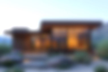 Büyüleyici modern ahşap bir ev, doğaya uyum içinde yerleşmiş, sıcak ışıklandırma ve zarif peyzajlar sunuyor, resimli bir ortamda huzurlu bir kaçış sunuyor..