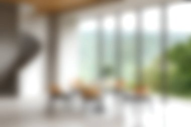 Bu resim, doğal ışıkla yıkanmış modern, minimalist bir iç mekan sergiliyor, manzaralı bir arka planda şık mobilyalar sergiliyor..