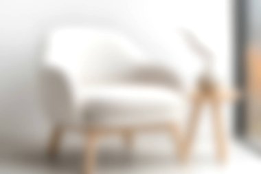 Bu resim, ahşap bacaklı minimalist bir koltuğu yakalar, içinde stil ve modern zarafetle dolu parlak bir iç mekan sergiler..