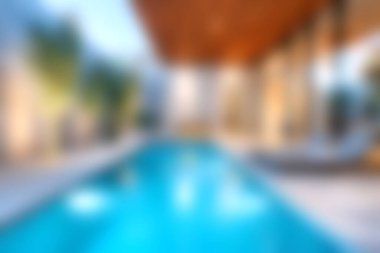 Bereketli yeşilliklerle çevrili, sakin bir ortamda rahatlamak, rahatlamak ve gençleşmek için mükemmel modern bir tasarım sergileyen sakin bir açık havuz..