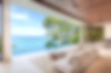 Modern zarafetle nefes kesici okyanus manzarasını birleştiren şık bir oturma odası keşfedin. Rahatlamak ve ilham vermek için mükemmel bir yer..