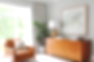 Parlak ve davetkar oturma odası, kahverengi bir kanepe, minimalist bir dekor, ve bol doğal ışık, modern bir yerde rahatlama ve rahatlama için ideal..