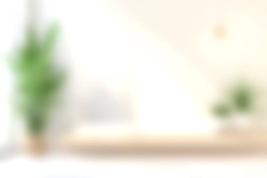 Zarif yeşil bitkiler ve minimalist dekor elementlerinin yer aldığı parlak ve havadar bir iç mekan, dinlenmek veya çalışmak için sakin ve şık bir atmosfer yaratıyor..