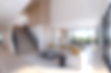 Modern bir oturma odasının parlak ve havadar bir görüntüsü. Minimalist tasarım, şık mobilyalar ve dingin ve davetkar bir atmosfer için canlı doğal ışık sergileniyor..