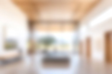 Huzurlu ve çağdaş bir oturma odasında geniş pencereli geniş bir tasarım sergileniyor, doğal ışığı davet ediyor, ve minimalist estetik, rahatlamak için mükemmel..