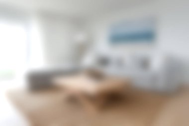 Modern mobilyaların olduğu sakin bir oturma odası ve temiz, minimalist bir tasarım. Yumuşak ışıklandırma rahat bir atmosfer yaratır, rahatlamak için mükemmeldir..