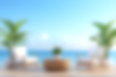 Sahil manzarasında rahat sandalyeler ve yemyeşil bitkilerle çevrili bir masa. Arkaplanda muhteşem bir okyanus manzarası sergileniyor. Parlak, berrak bir gökyüzünün altında..