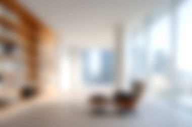 Bu resim, minimalist tasarım ve konforlu mobilyalarla karakterize edilmiş parlak ve modern bir oturma odasını, doğal ışıkla dolu huzurlu bir atmosfer yaratıyor..