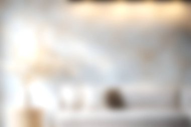 Yumuşak ışıklandırma, minimalist dekor ve rahatlatıcı bir atmosferi olan rahat, modern bir oturma odası. Çağdaş iç tasarım fikirlerini göstermek için ideal.