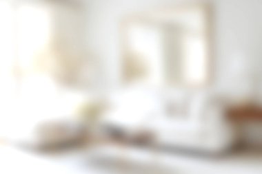 Parlak bir oturma odasının, doğal ışıkla yıkanmış zarif mobilyaları gösteren güzel bulanık bir görüntüsü. Davetkar atmosfer huzur ve rahat bir atmosfer yaratıyor. Rahatlamak için mükemmel..