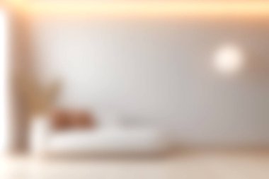 Sıcak ortam aydınlatmalı rahat bir kanepenin olduğu modern bir minimalist oturma odası. Huzur ve sükunet hissi yaratıyor. Rahatlamak için ideal..