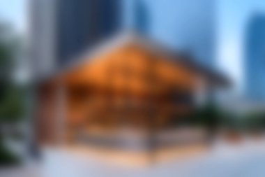 Çarpıcı bir ahşap pavyon gökdelenlerin ortasında duruyor, doğa ve modern şehir hayatının uyumlu bir karışımını oluşturuyor. Açık hava toplantıları için ideal..