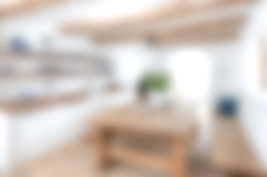 Bu görüntüde parlak ve havadar modern bir mutfak, ahşap mobilyalar ve minimalist dekorlar sergilenmektedir. Açık alan sıcaklığı ve rahat bir atmosferi davet eder..