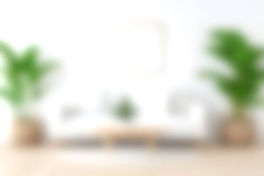 Yeşillik bitkiler ve minimalist dekorun yer aldığı çağdaş bir oturma odası rahatlama ve rahatlama için ideal sakin bir atmosfer yaratır. Beyaz duvarlar doğal ışığı arttırıyor, rahatlığı ve tarzı vurguluyor..